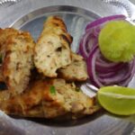 chicken kabab serving with onions and lemon
